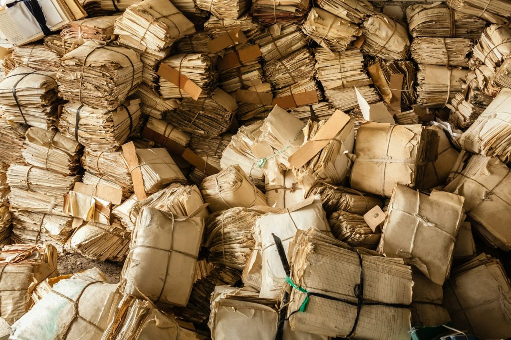 Paper Waste Background. Many Keeping Records In Heap